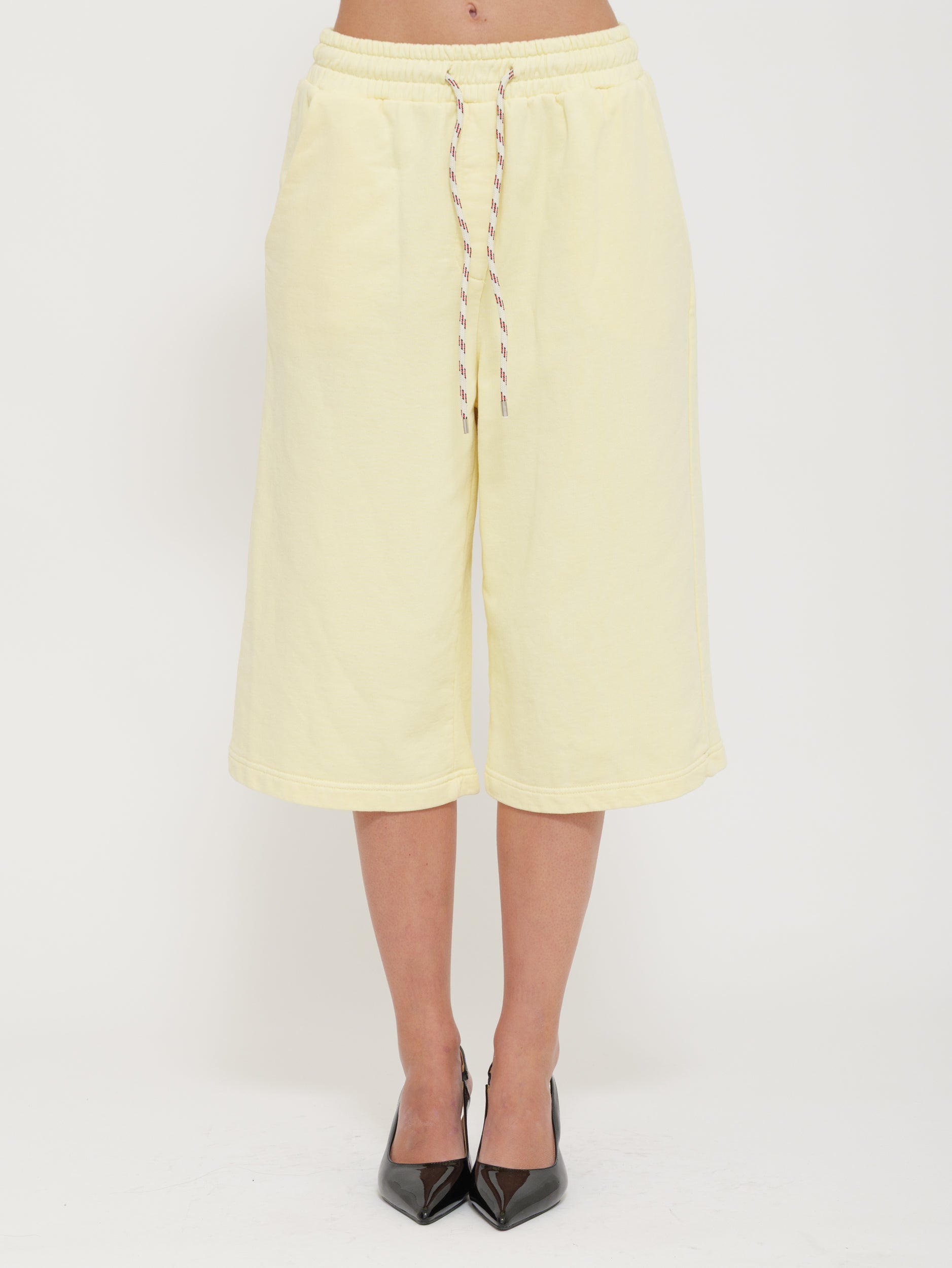 Tuta bermuda con laccio regolabile