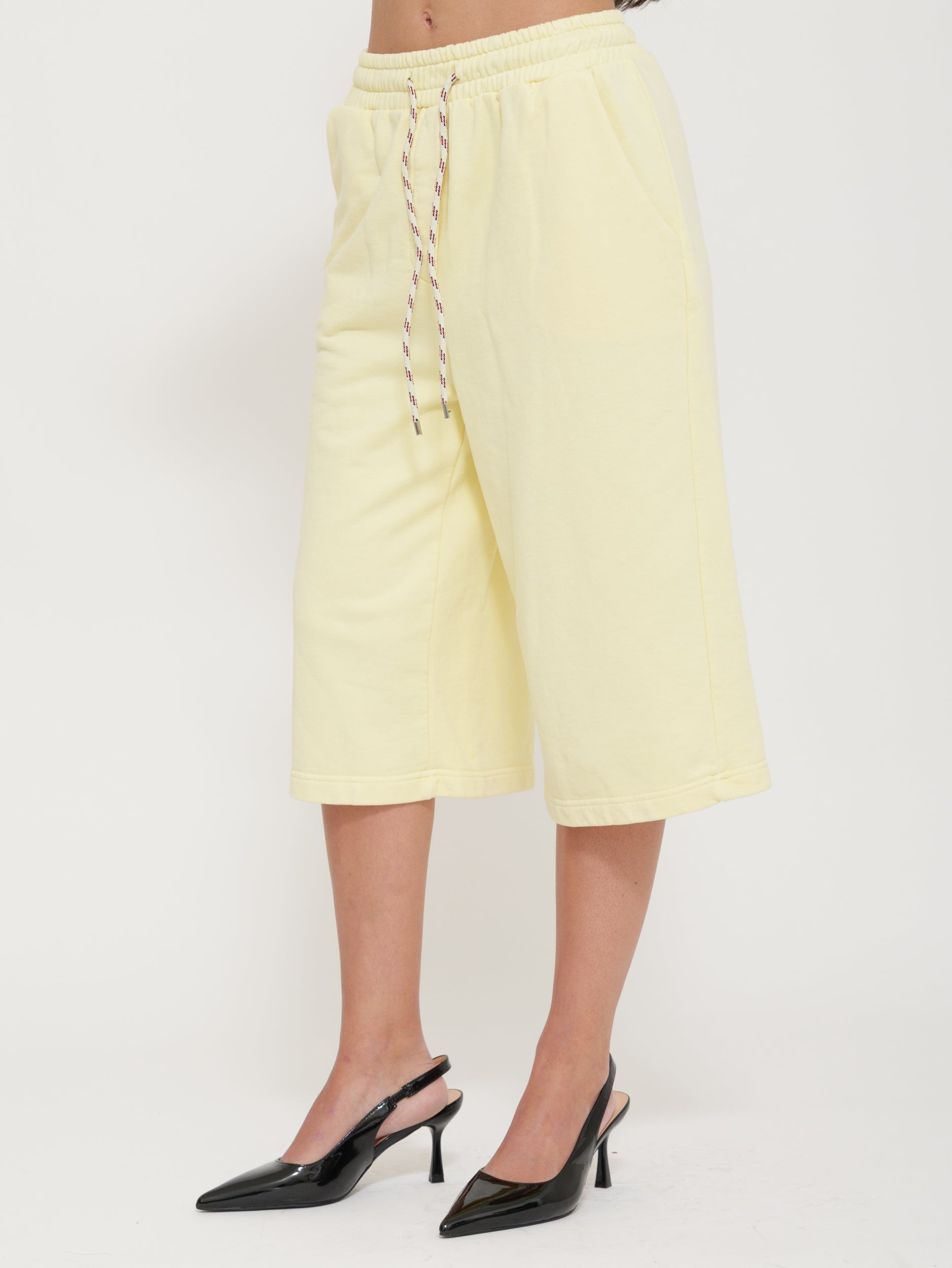 Tuta bermuda con laccio regolabile