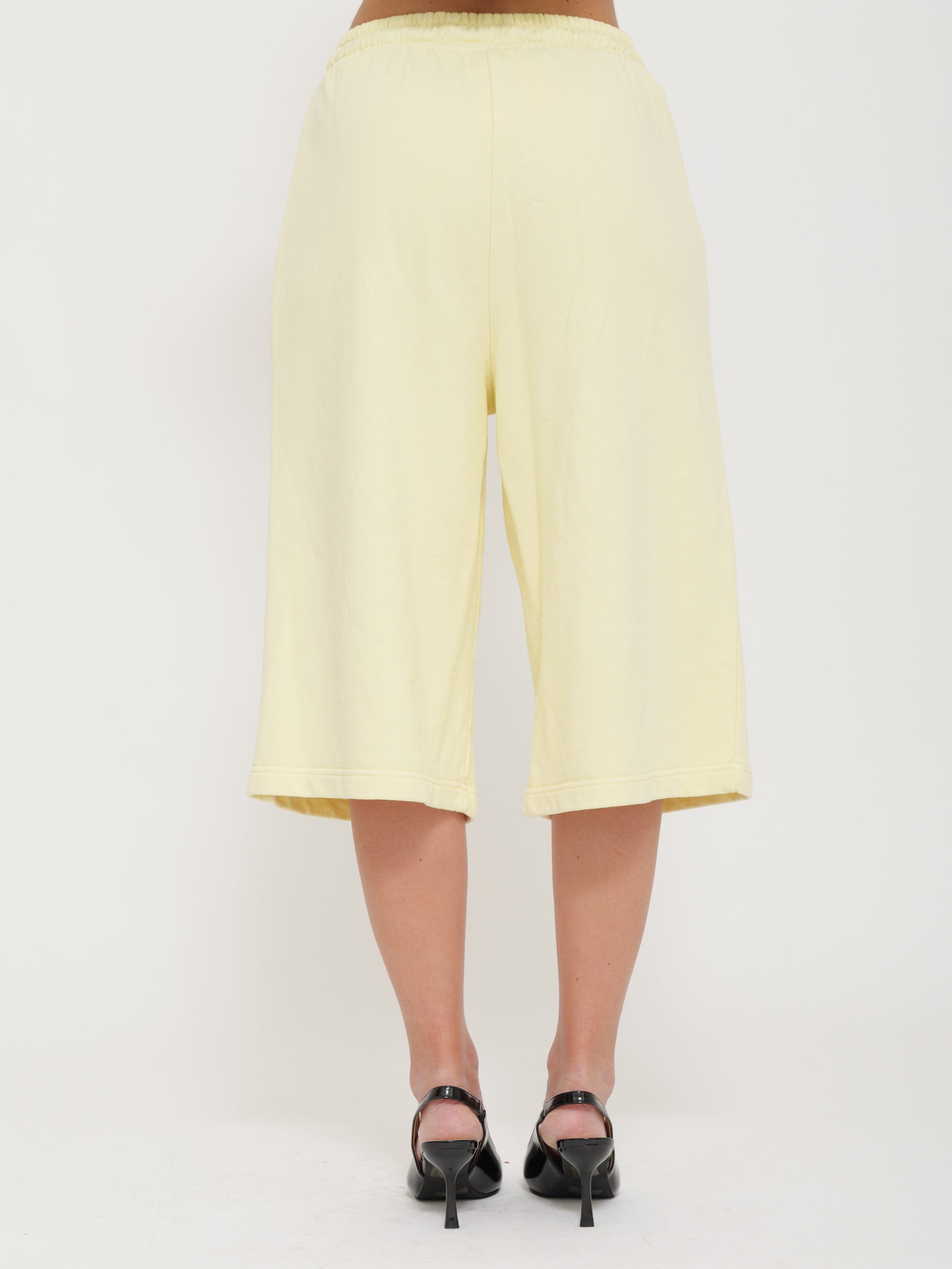 Tuta bermuda con laccio regolabile